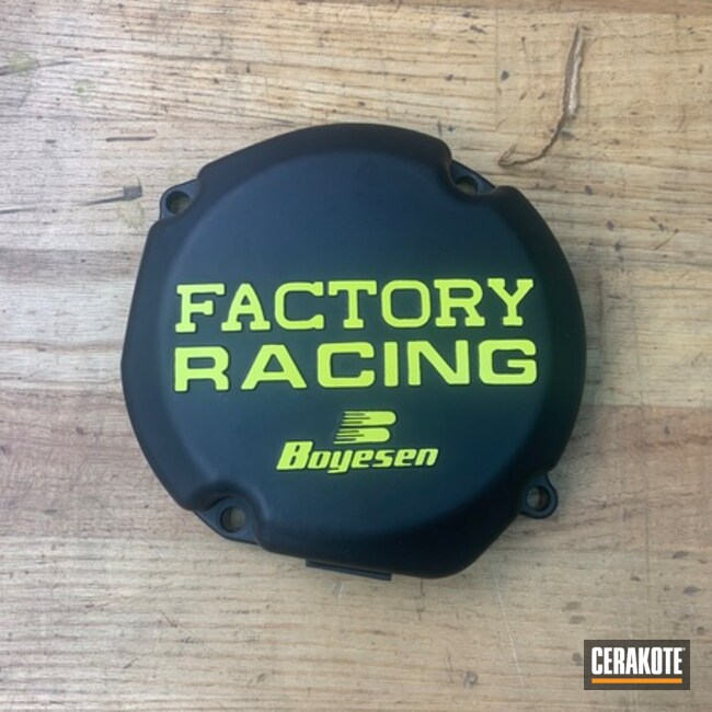 Motorcycle Clutch Cover Cerakoted Black With Yellow Lettering 
