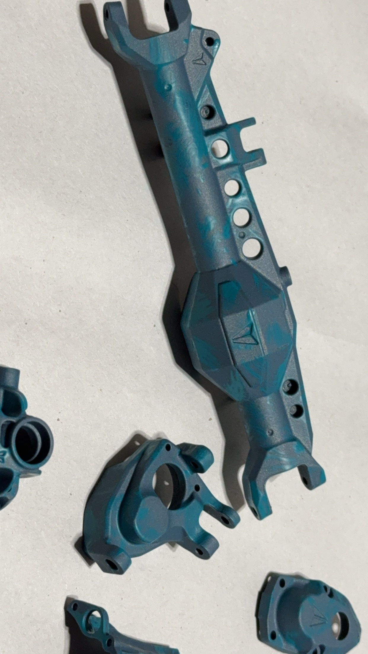 Axle done in Blue Titanium and Aqua Teal | Cerakote