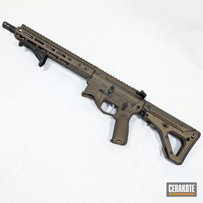 Ar-15 Recoated In Midnight Bronze Shown With Original And Woox Wood Furniture 