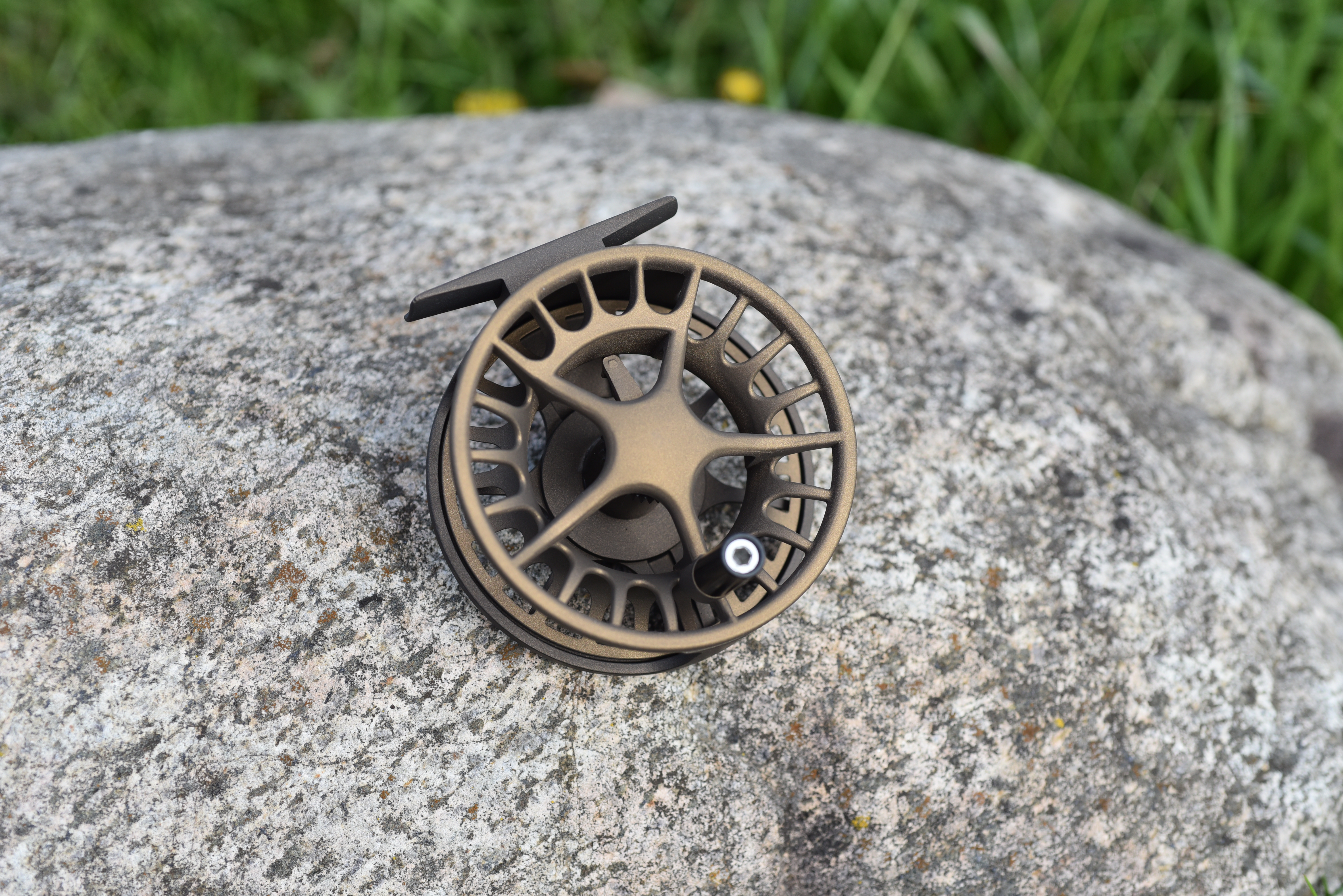 custom engraved fly reel Tibor Reels - The Riptide - Frost Silver with Lime - Tarpon Eng painted with sun yellow in the engravings. Hand Engraving by Oyster |