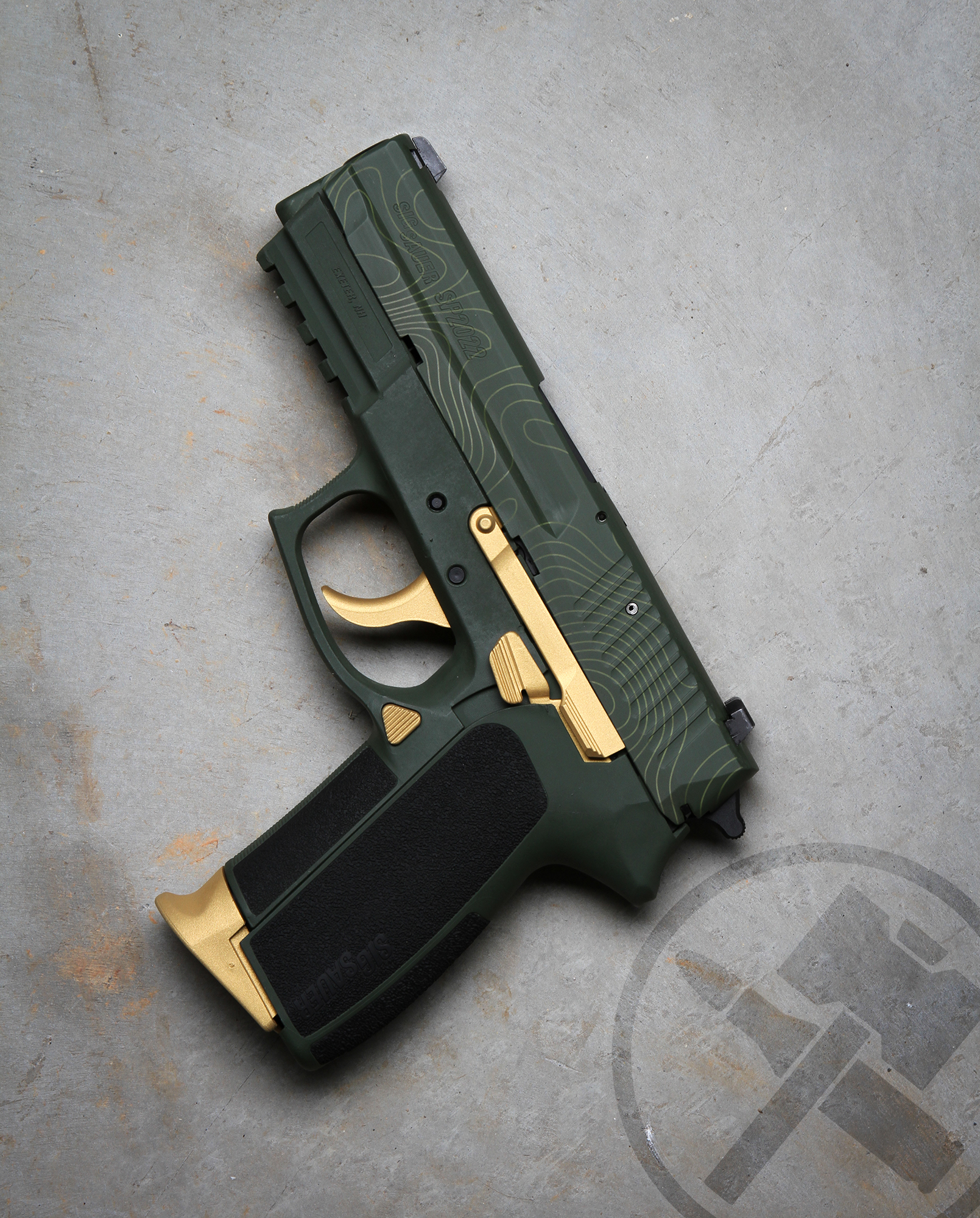 Sp2022 in a Graphite Black, FS Green and Gold Finish | Cerakote