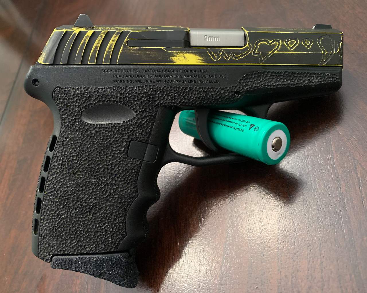 Sccy using Corvette Yellow, NRA Blue and Graphite Black | Cerakote