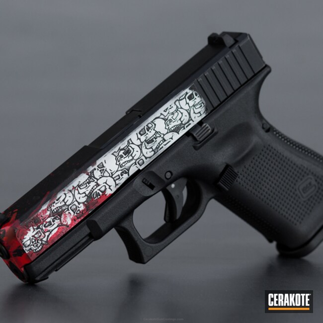 Cerakoted Laser Engraved Glock 19 Handgun Coated In A Skull Camo And Splatter Theme