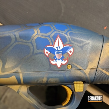 Cerakoted Winchester Shotgun Coated In A Bluish/gold Kryptek Pattern