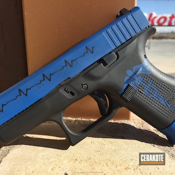 Cerakoted Emt Heartbeat Themed Glock 42 Handgun Coated In Graphite Black And Nra Blue