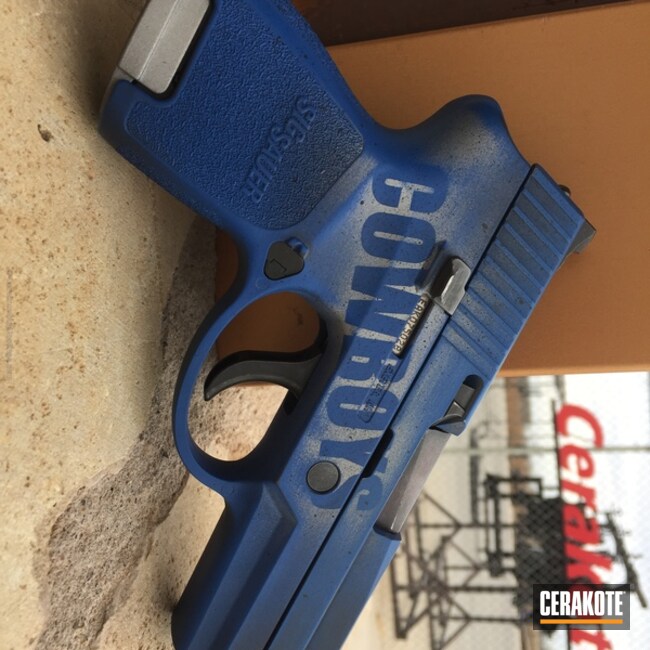 Cerakoted Sports Themed Sig Sauer Handgun Coated In Crushed Silver, Graphite Black And Nra Blue