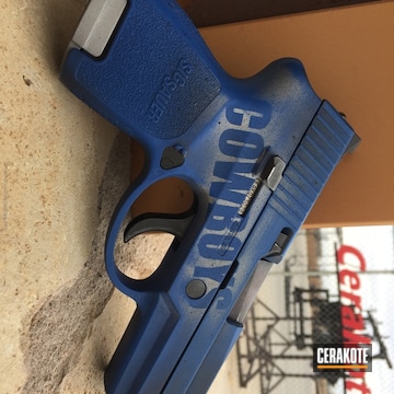 Cerakoted Sports Themed Sig Sauer Handgun Coated In Crushed Silver, Graphite Black And Nra Blue