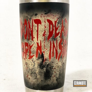 Cerakoted Tv Show Themed Cup Coated In A Distressed Graphite Black, Crimson And Desert Sand