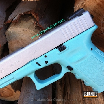 Cerakoted Glock 23 Handgun Done In A Two Toned Robin's Egg Blue And Satin Aluminum Finish