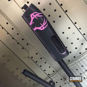 Cerakoted Shotgun Parts Coated In Graphite Black And Prison Pink Cerakote
