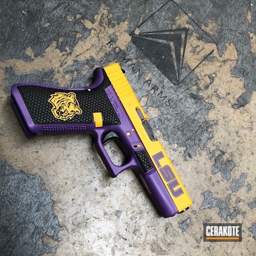 Cerakoted Glock 22 Handgun Coated In H-217 Bright Purple And H-126 Dewalt Yellow