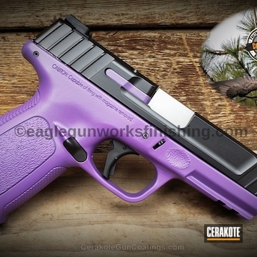 Cerakoted Two Toned Smith & Wesson Handgun Done In Graphite Black And Bright Purple