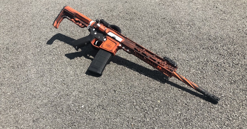 Battleworn Tactical rifle done in Cerakote Black, Orange and Grey by ...