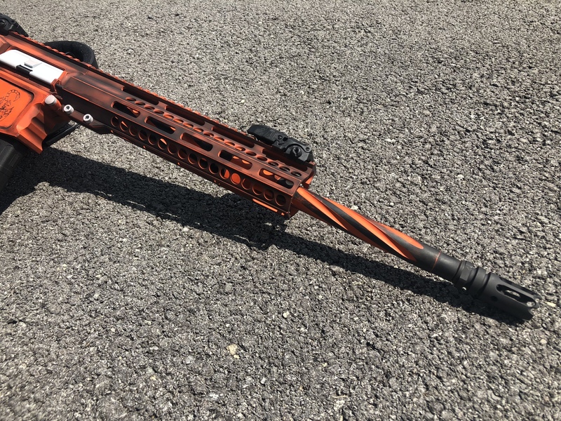 Battleworn Tactical rifle done in Cerakote Black, Orange and Grey by ...