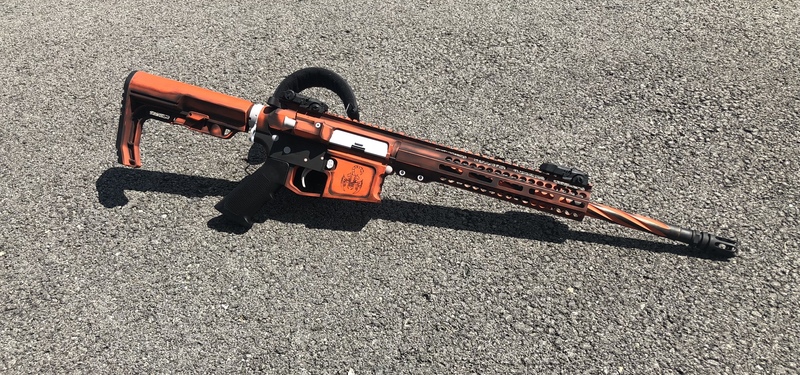 Battleworn Tactical rifle done in Cerakote Black, Orange and Grey by ...