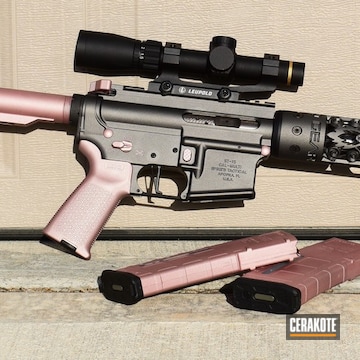 Cerakoted Tactical Rifle And Offhand Gear Handguard With A Rose Gold And Black Finish