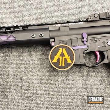 Cerakoted Black Ar-15 Rifle With Pink And Purple Accent Colors