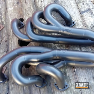 Cerakoted Pair Of Manifolds Coated In Glacier Black For A Local Custom Exhaust Company