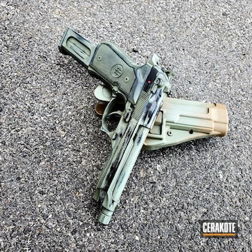 Cerakoted Beretta Handgun With A Custom Cerakote Battleworn Finish