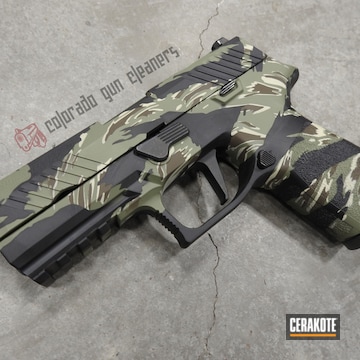 Cerakoted Sig Sauer P320 Handgun With A Cerakote Vietnam Tiger Stripe Camo Finish