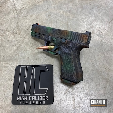 Cerakoted Laser Engraved Glock 19 Handgun With A Multicolor Cerakote Finish