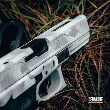 Cerakoted Glock 17 Handgun With A Cerakote Arctic Camo Finish Using H-213, H-136 And H-242
