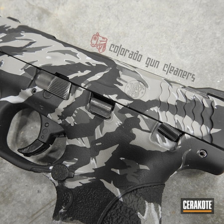 Powder Coating: Smith & Wesson,Smith & Wesson M&P Shield,Graphite Black H-146,Gun Coatings,S.H.O.T,Pistol,Steel Grey H-139,BATTLESHIP GREY H-213,Vietnam Tiger Stripe Camo,SIG™ DARK GREY H-210