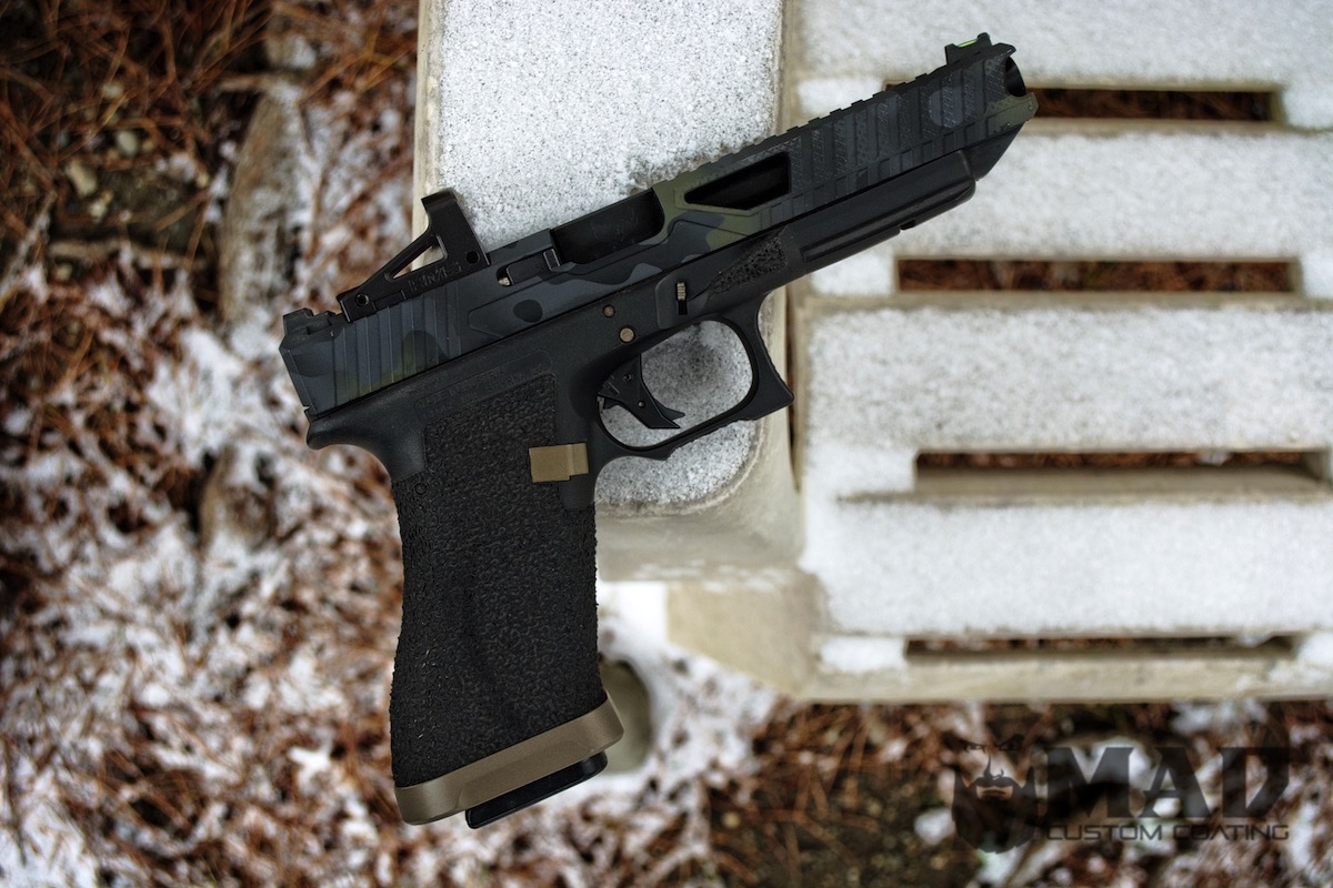 Glock 34 Handgun finished with Sniper Grey, Graphite Black and