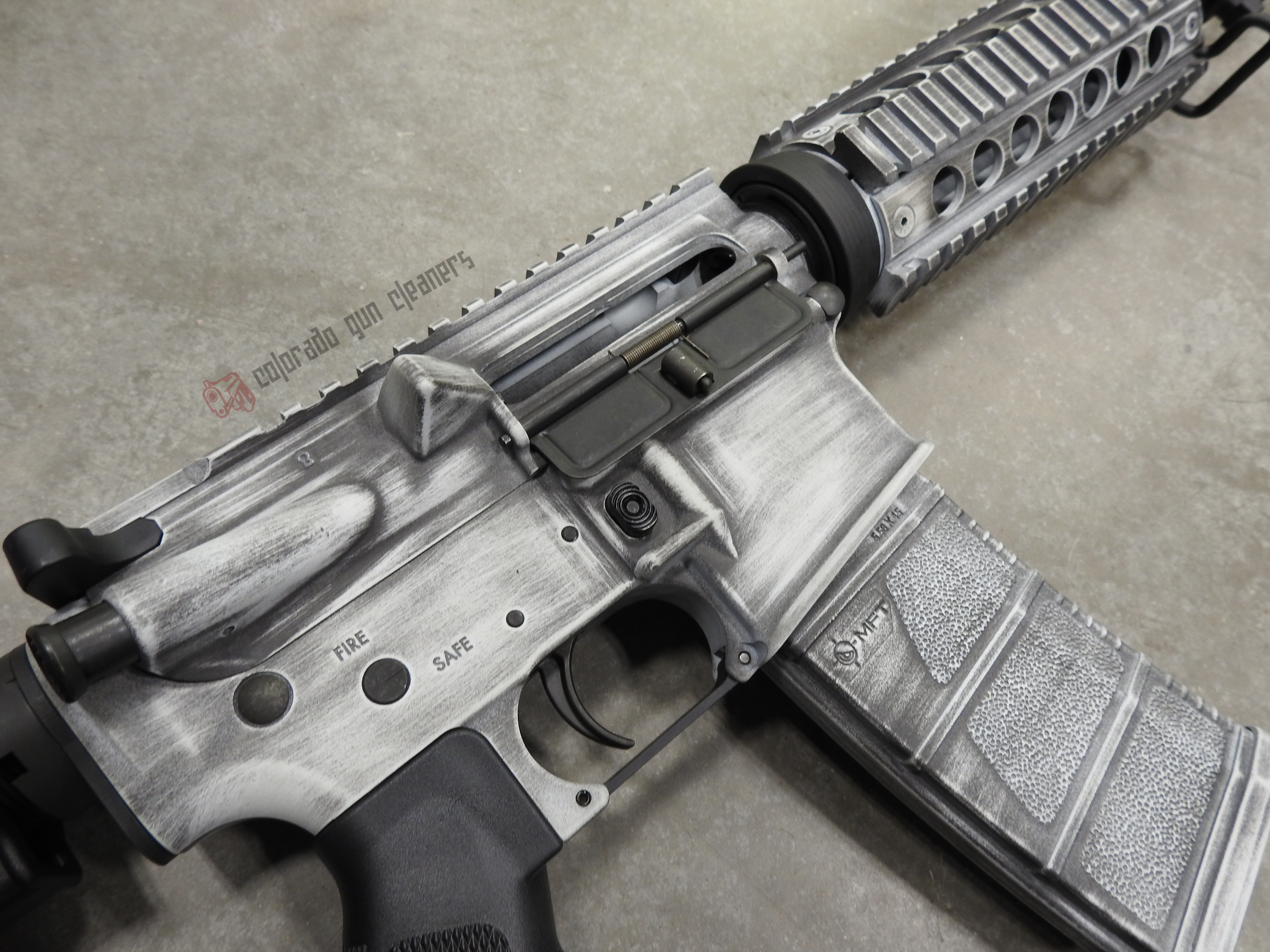 Distressed Rifles Distressed AR-15 featuring Graphite Black and Stormtrooper White | Cerakote