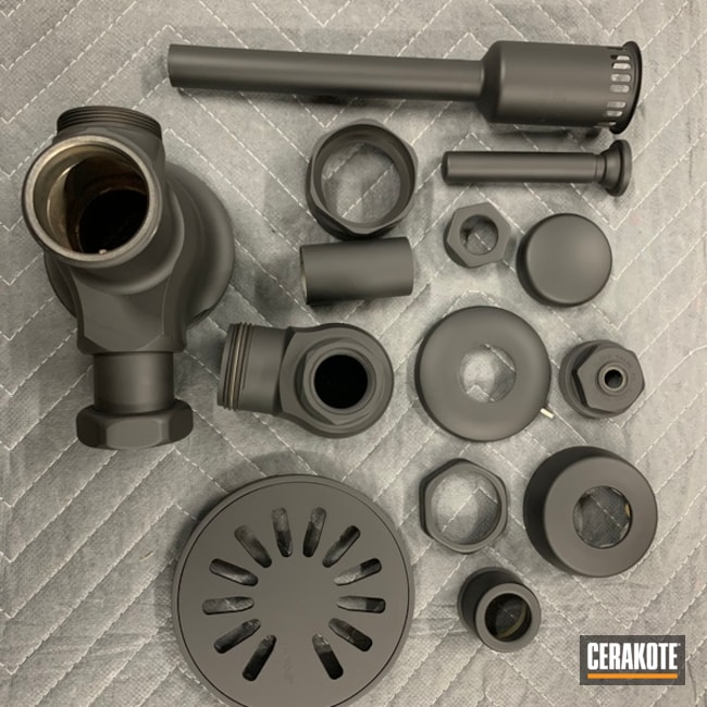 Shower Drain And Urinal Components Cerakoted Using Armor Black