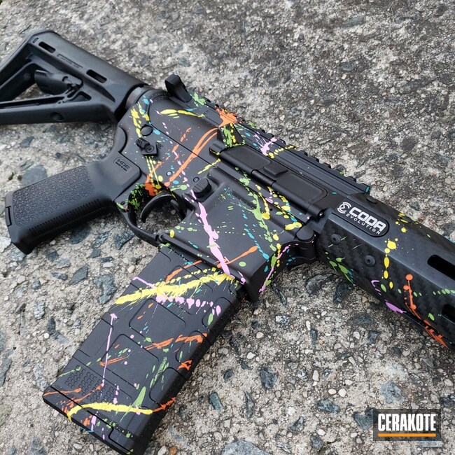 Paint Splattered AR Cerakoted using Armor Black, Zombie Green and Hi-vis  Orange