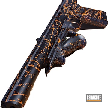 Paint Splattered Browning Buck Mark Pistol Cerakoted Using Armor Black And Hi-vis Orange