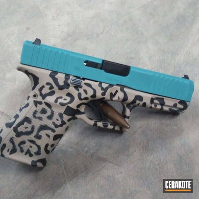 Cheetah Print Glock 17 Pistol Cerakoted Using Desert Sand, Aztec Teal And Graphite Black