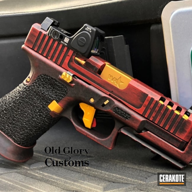 Battleworn Glock 19 Cerakoted Using Graphite Black, Firehouse Red And Gold