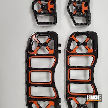 Two Tone Motorcycle Floorboards Cerakoted Using Hunter Orange, High Gloss Ceramic Clear And Graphite Black