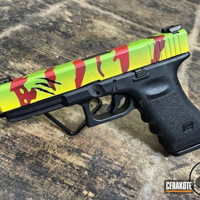 Jurassic Park Themed Glock Cerakoted Using Zombie Green, Graphite Black And Firehouse Red
