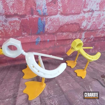Duck Sculpture Cerakoted Using Hunter Orange, Bright White And Corvette Yellow