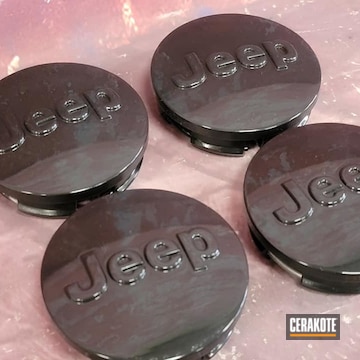 Jeep Wheel Center Caps Cerakoted Using High Gloss Ceramic Clear And Graphite Black