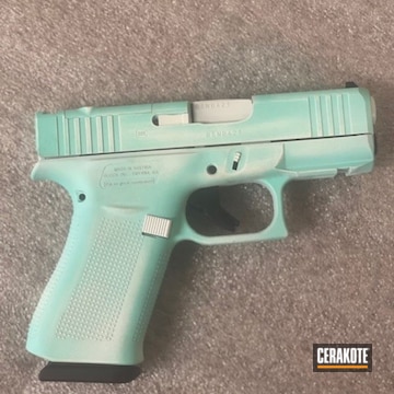 Distressed Glock 43 Cerakoted Using Stormtrooper White And Robin's Egg Blue