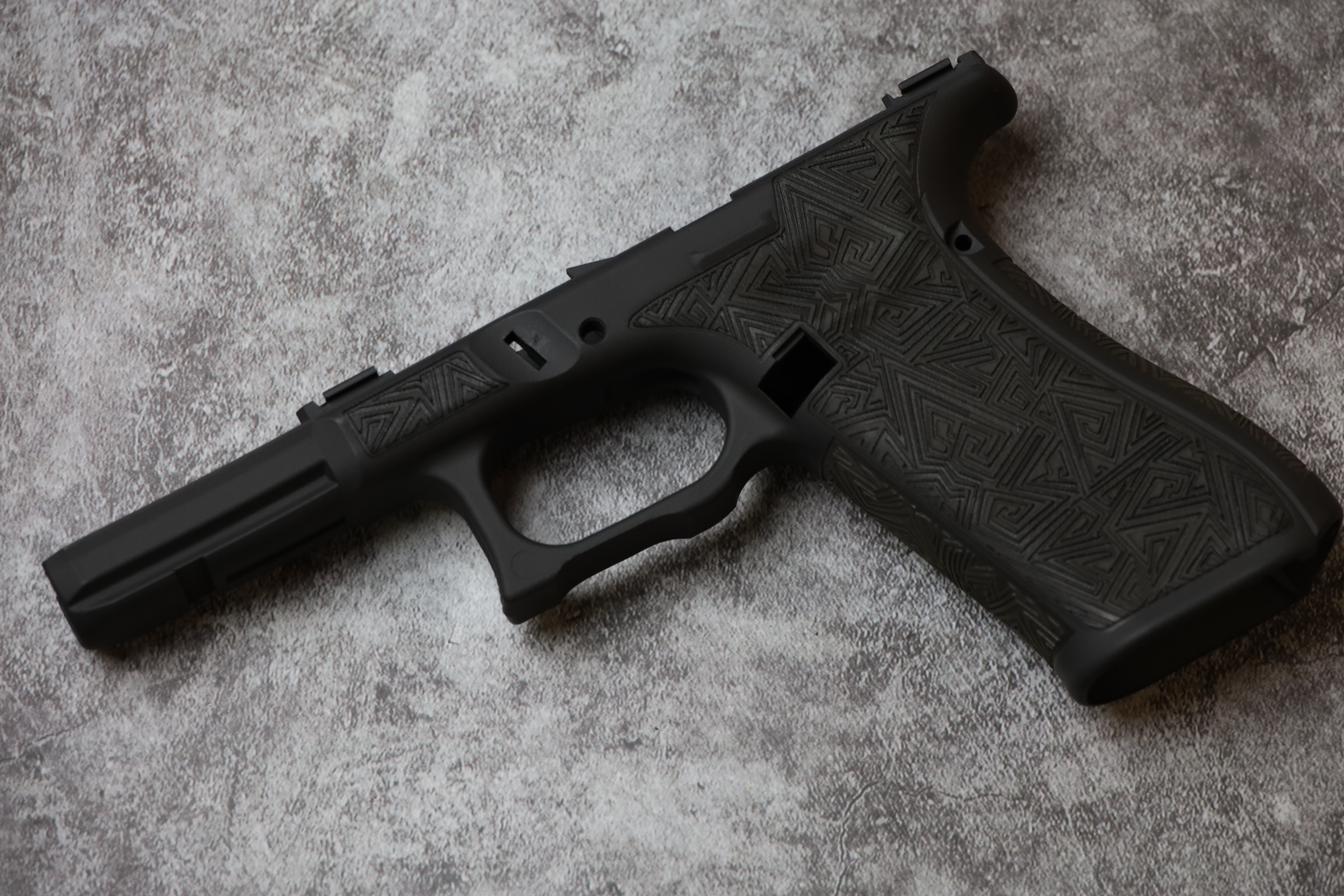 Stippled Frame Glock 17 Frame Cerakoted using Graphite Black | Cerakote