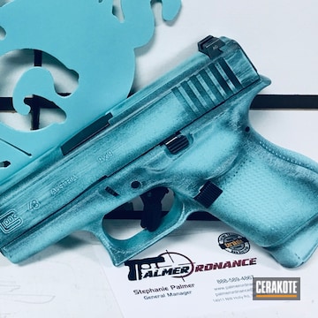 Cerakoted Graphite Black And Robin's Egg Blue Battleworn Glock 43