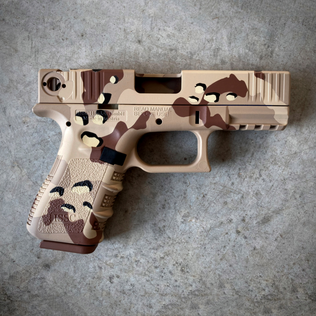 Chipped Coating Rifle Chocolate Chip Camo on ISSC handgun | Cerakote