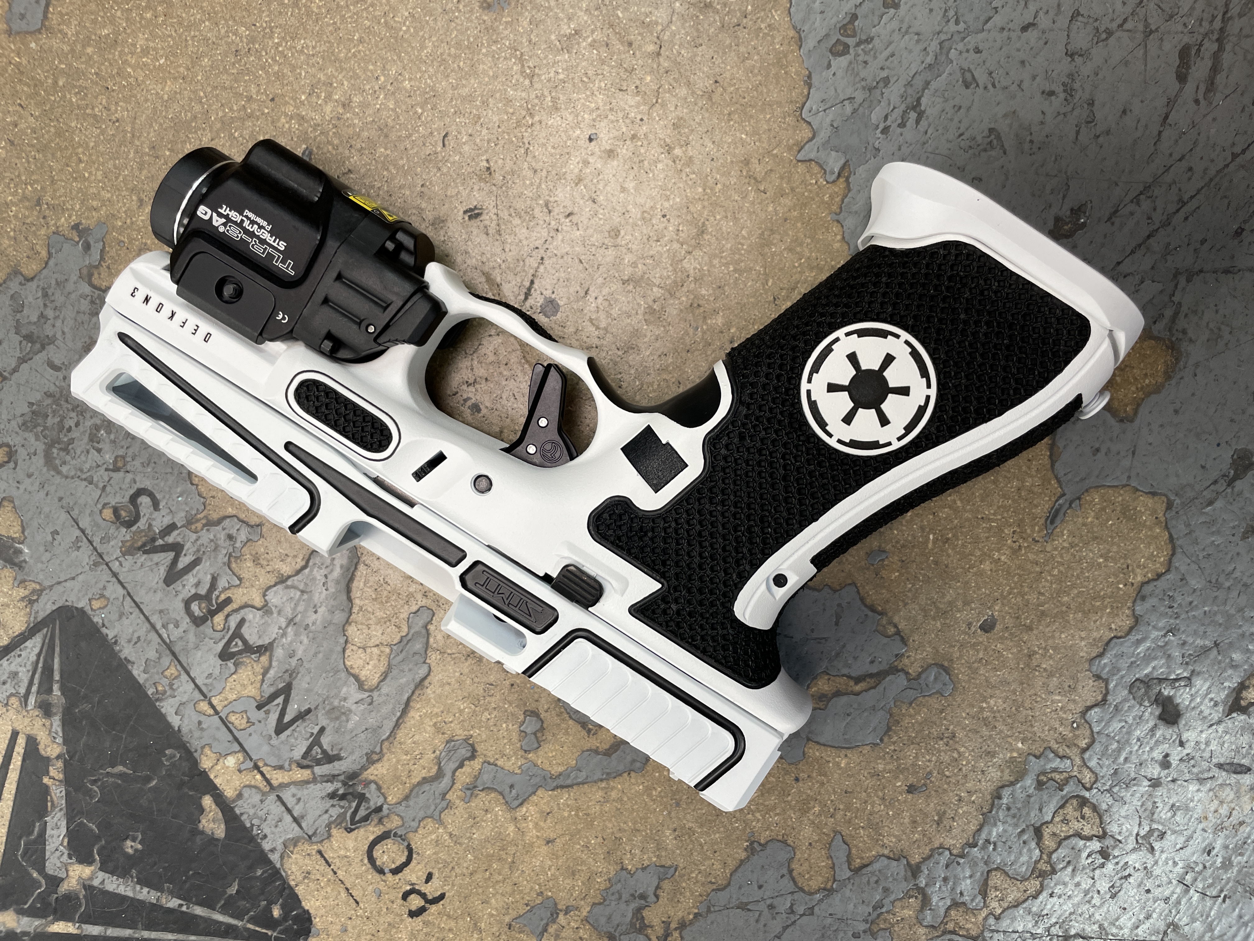 Custom Glock Frame finished in Bright White and Graphite Black | Cerakote