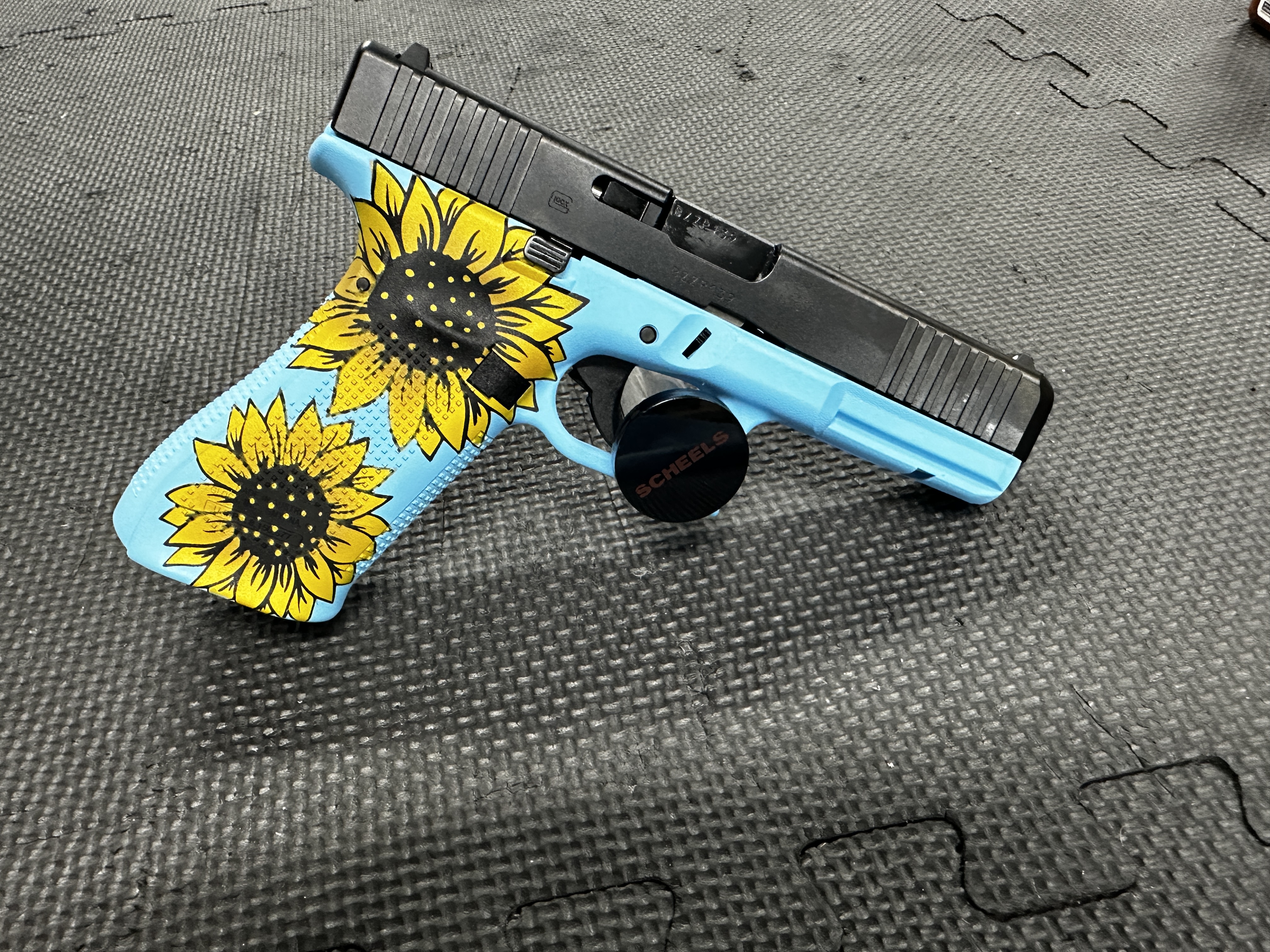Blue Raspberry Cerakote Glock 17 finished in a Sunflower and Blue Raspberry Finish | Cerakote