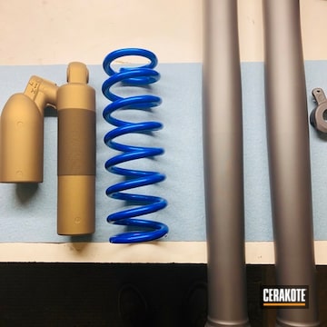 Dirt Bike Parts Coated With Cerakote In Gloss Black, Burnt Bronze And Gold
