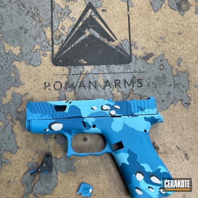 Glock 43 Coated With Cerakote In Hidden White, Ridgeway Blue, Blue Raspberry, Sea Blue And Midnight Blue