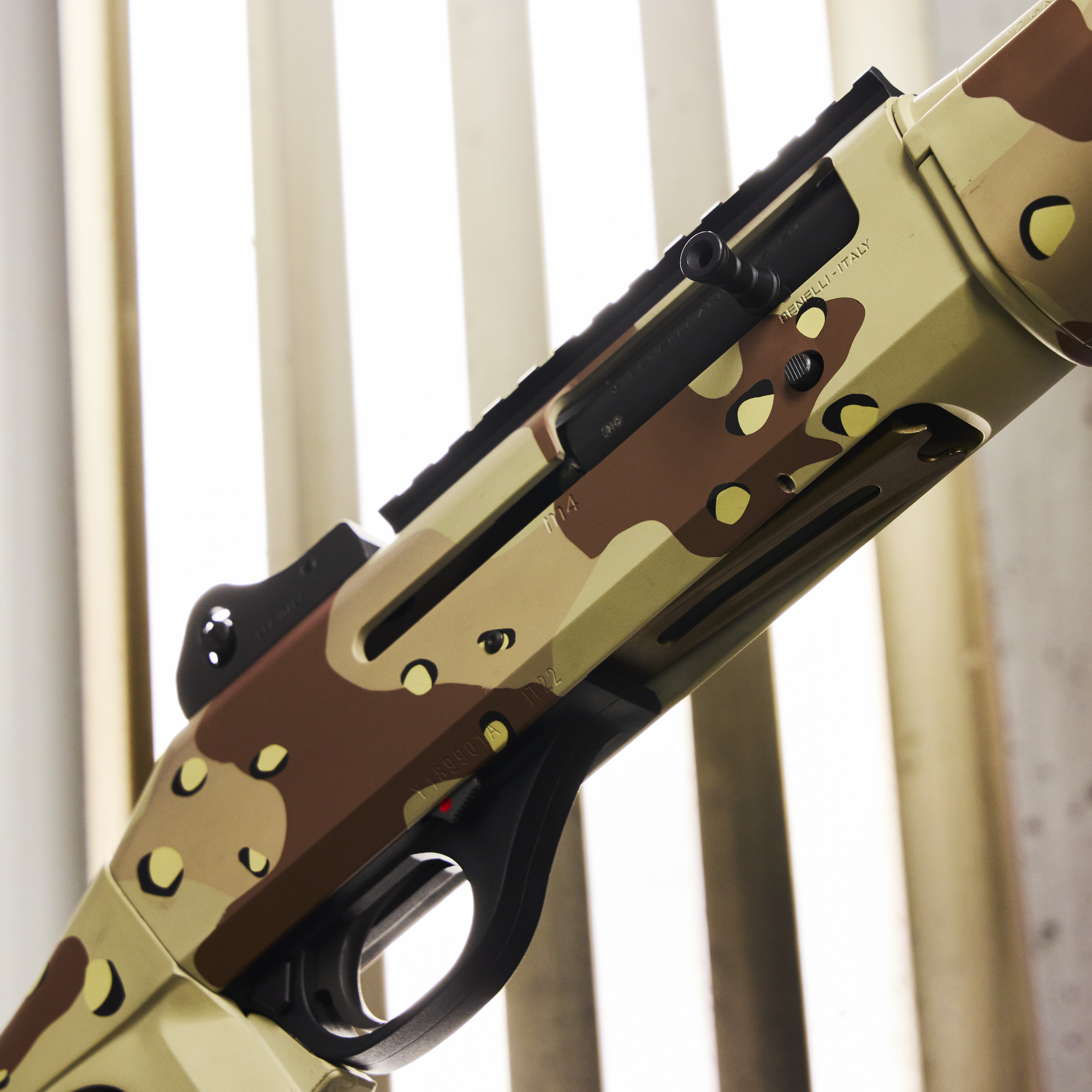 Chipped Coating Rifle Benellie shotgun coated in chocolate chip camouflage | Cerakote