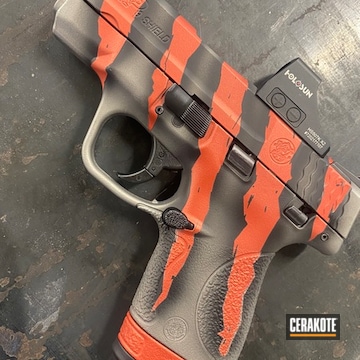 Tiger Stripe M&p Shield Coated With Cerakote In Savage® Stainless, Graphite Black And Blood Orange
