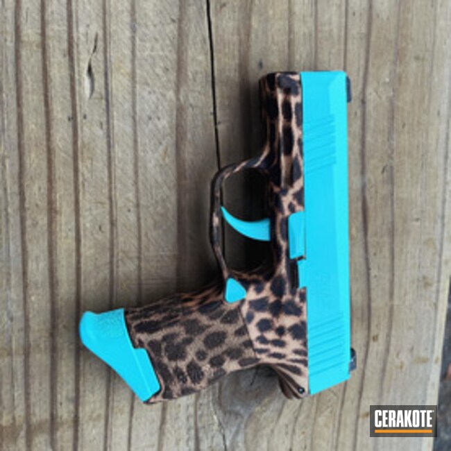 Sig P365 With Cheetah Print And Robin's Egg Blue Coated With Cerakote In Black Cherry, Robin's Egg Blue And Burnt Bronze
