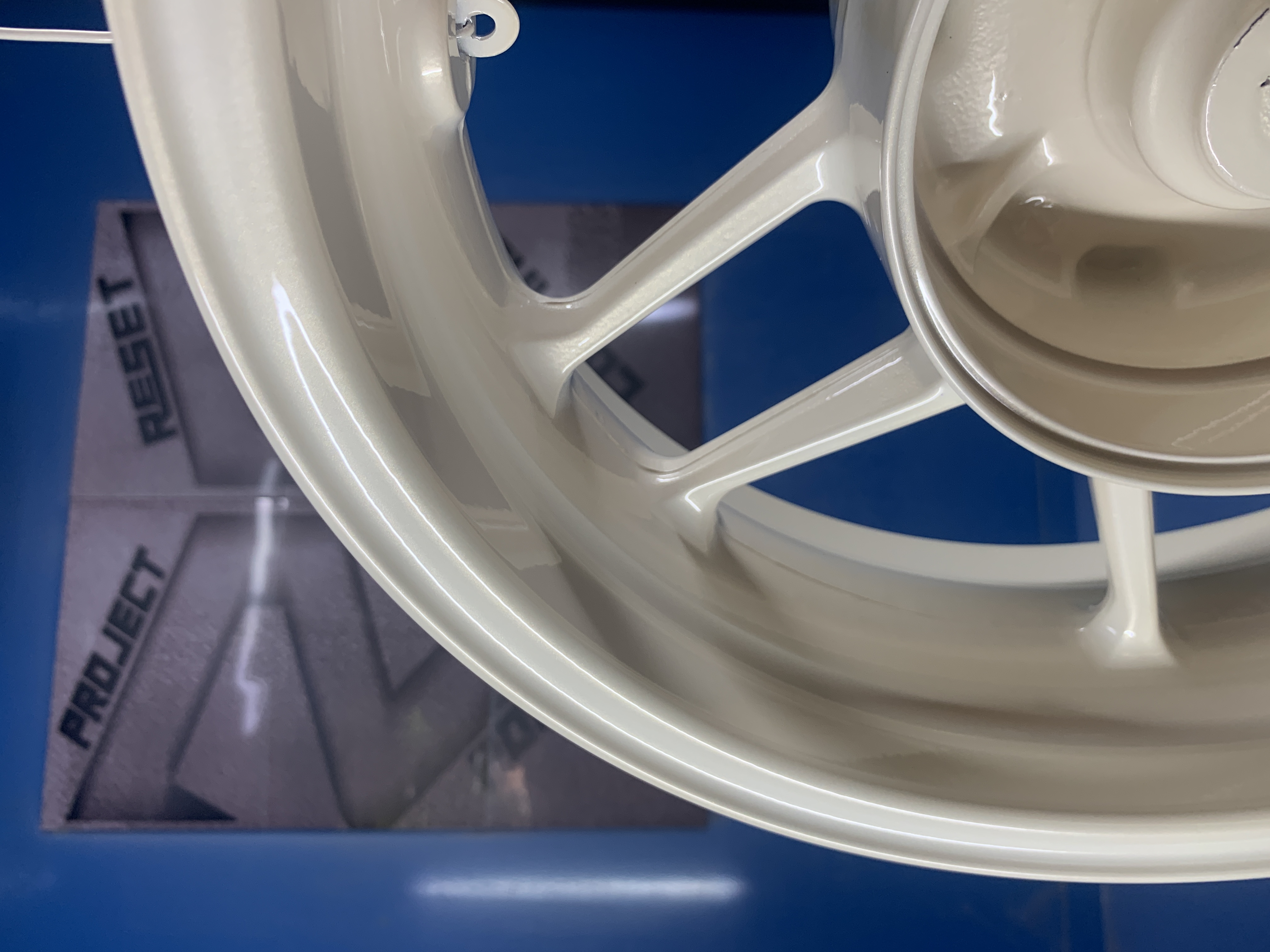 Pearl white on Honda Adv160 rims | Prismatic Powders